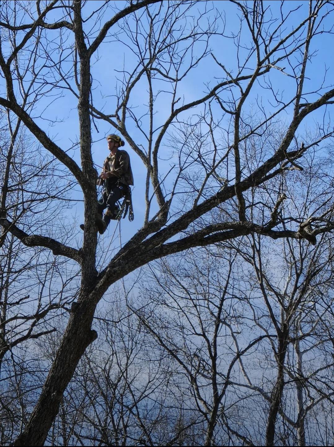 Justin roped in high up with full safety gear